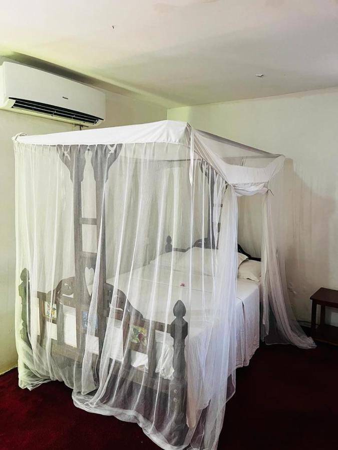 Triniti Oysterbay Hotel Dár Al-Szalám Szoba fotó
